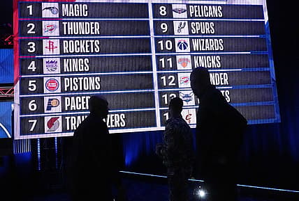 May 17, 2022; Chicago, IL, USA; People look at the draft lottery order after the 2022 NBA Draft Lottery at McCormick Place. Mandatory Credit: David Banks-USA TODAY Sports