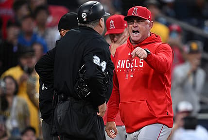 Jul 5, 2023; San Diego, California, USA; Los Angeles Angels manager Phil Nevin (right) argues with home plate umpire Jerry Layne (24) during the seventh inning at Petco Park. Mandatory Credit: Orlando Ramirez-USA TODAY Sports