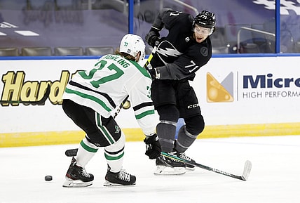 Feb 27, 2021; Tampa, Florida, USA; Tampa Bay Lightning center Anthony Cirelli (71) shoots as Dallas Stars center Justin Dowling (37) defend during the first period at Amalie Arena. Mandatory Credit: Ki Klement-USA TODAY Sports