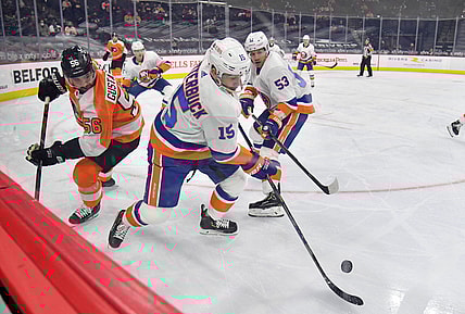 Mar 22, 2021; Philadelphia, Pennsylvania, USA; New York Islanders right wing Cal Clutterbuck (15) skates away from Philadelphia Flyers defenseman Erik Gustafsson (56) during the first period at Wells Fargo Center. Mandatory Credit: Eric Hartline-USA TODAY Sports