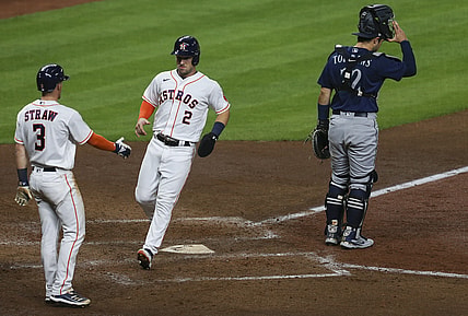 Apr 26, 2021; Houston, Texas, USA; Houston Astros center fielder Myles Straw (3) congratulates third baseman Alex Bregman (2) for scoring against the Seattle Mariners in the fifth inning at Minute Maid Park. Mandatory Credit: Thomas Shea-USA TODAY Sports