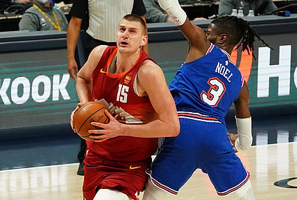 May 5, 2021; Denver, Colorado, USA;Denver Nuggets center Nikola Jokic (15) drives around New York Knicks center Nerlens Noel (3) in the second quarter at Ball Arena. Mandatory Credit: Ron Chenoy-USA TODAY Sports