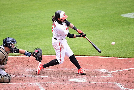 May 16, 2021; Baltimore, Maryland, USA; Baltimore Orioles shortstop Freddy Galvis (2) hits an RBI single in the third inning against the New York Yankees at Oriole Park at Camden Yards. Mandatory Credit: Evan Habeeb-USA TODAY Sports