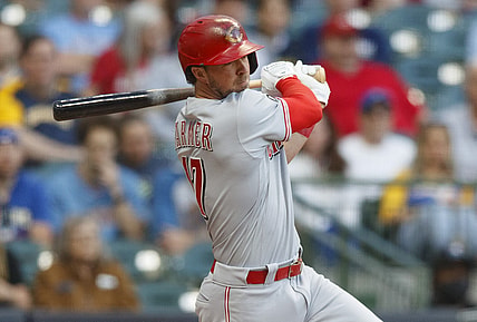 Jun 15, 2021; Milwaukee, Wisconsin, USA;  Cincinnati Reds second baseman Kyle Farmer (17) singles during the third inning against the Milwaukee Brewers at American Family Field. Mandatory Credit: Jeff Hanisch-USA TODAY Sports