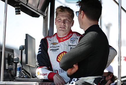 Team Penske drivers Josef Newgarden (2)  and Will Power (12) talk Sunday, May 30, 2021, after the 105th running of the Indianapolis 500 at Indianapolis Motor Speedway.