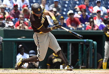 Jul 18, 2021; Washington, District of Columbia, USA; San Diego Padres left fielder Tommy Pham (28) hits an RBI single against the Washington Nationals in the 7th inning after resuming play from last night's suspended game at Nationals Park. Mandatory Credit: Brad Mills-USA TODAY Sports