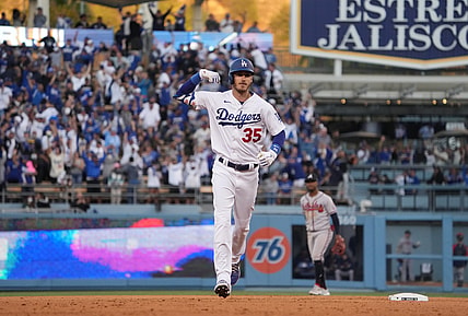 Oct 19, 2021; Los Angeles, California, USA; Los Angeles Dodgers first baseman Cody Bellinger (35) celebrates after hitting a three-run home run in the eighth inning of game three of the 2021 NLCS against the Atlanta Braves at Dodger Stadium. Mandatory Credit: Kirby Lee-USA TODAY Sports