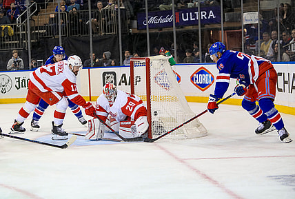 Feb 17, 2022; New York, New York, USA; New York Rangers defenseman K'Andre Miller (79) scores a wrap-around goal on Detroit Red Wings defenseman Gustav Lindstrom (28) during the second period at Madison Square Garden. Mandatory Credit: Danny Wild-USA TODAY Sports