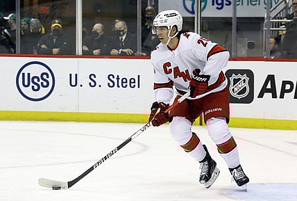 Mar 13, 2022; Pittsburgh, Pennsylvania, USA;  Carolina Hurricanes defenseman Ethan Bear (25) handles the puck against the Pittsburgh Penguins during the second period at PPG Paints Arena. Mandatory Credit: Charles LeClaire-USA TODAY Sports