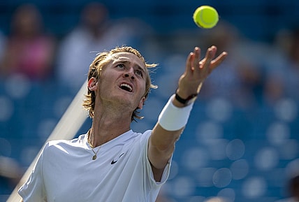 Aug 18, 2022; Cincinnati, OH, USA; Sebastian Korda (USA) tosses the ball to serve during his match against John Isner (USA) at the Western & Southern Open at the at the Lindner Family Tennis Center. Mandatory Credit: Susan Mullane-USA TODAY Sports