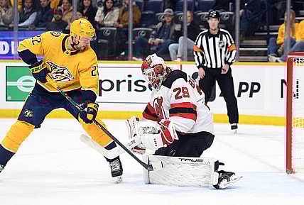 Jan 26, 2023; Nashville, Tennessee, USA; Nashville Predators right wing Nino Niederreiter (22) has a shot blocked by New Jersey Devils goaltender Mackenzie Blackwood (29) during the first period at Bridgestone Arena. Mandatory Credit: Christopher Hanewinckel-USA TODAY Sports