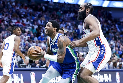 Mar 2, 2023; Dallas, Texas, USA;  Dallas Mavericks guard Kyrie Irving (2) drives to the basket past Philadelphia 76ers guard James Harden (1) during the first quarter at American Airlines Center. Mandatory Credit: Kevin Jairaj-USA TODAY Sports