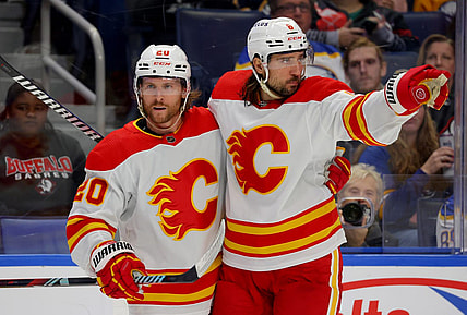 Oct 19, 2023; Buffalo, New York, USA;  Calgary Flames center Blake Coleman (20) celebrates his goal with defenseman Chris Tanev (8) during the third period against the Buffalo Sabres at KeyBank Center. Mandatory Credit: Timothy T. Ludwig-USA TODAY Sports
