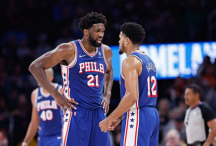 Nov 25, 2023; Oklahoma City, Oklahoma, USA; Philadelphia 76ers center Joel Embiid (21) and forward Tobias Harris (12) talk between plays against the Oklahoma City Thunder during the second half at Paycom Center. Mandatory Credit: Alonzo Adams-USA TODAY Sports