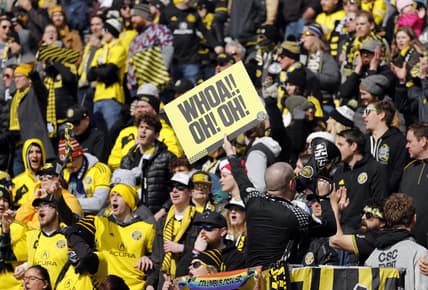 Fans in the Nordecke celebrate a goal in a game early last year, before COVID-19 emptied the stadium. Members of the independent supporters group said they were disappointed that they were not asked to be more involved in deciding the team's new name and logo.

Sp Crew 030220 Ac 18
