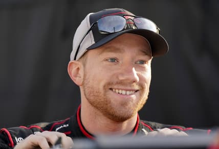 Aug 15, 2021; Speedway, Indiana, USA; NASCAR Cup Series driver Tyler Reddick (8) looks on before the Verizon 200 at the Brickyard at Indianapolis Motor Speedway Road Course. Mandatory Credit: Mike Dinovo-USA TODAY Sports