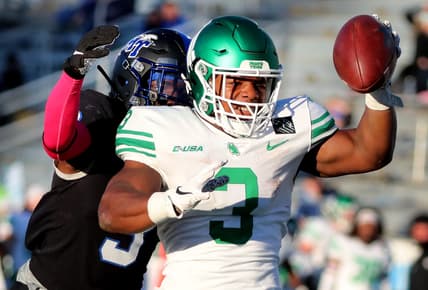 North Texas running back DeAndre Torrey (3) reaches out to make a touchdown as MTSU safety Gregory Grate Jr. (3) tackles him on Saturday, Oct. 17, 2020, during the Blackout game at MTSU.

29 Mtsu V North Texas