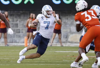 Sep 3, 2021; Blacksburg, Virginia, USA; North Carolina Tar Heels quarterback Sam Howell (7) runs the ball during the first quarter at Lane Stadium. Mandatory Credit: Reinhold Matay-USA TODAY Sports