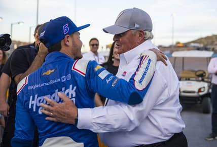 Nov 7, 2021; Avondale, Arizona, USA; NASCAR Cup Series driver Kyle Larson (left) celebrates with team owner Rick Hendrick after winning the NASCAR Cup Series Championship at Phoenix Raceway. Mandatory Credit: Mark J. Rebilas-USA TODAY Sports