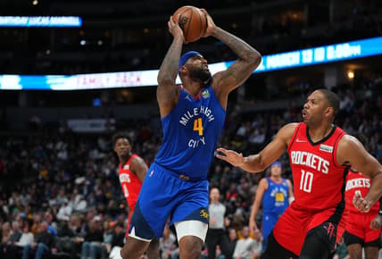 Mar 4, 2022; Denver, Colorado, USA; Denver Nuggets center DeMarcus Cousins (4) drives to the basket against Houston Rockets guard Eric Gordon (10) in the first quarter at Ball Arena. Mandatory Credit: Ron Chenoy-USA TODAY Sports