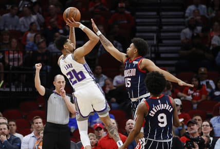 Apr 1, 2022; Houston, Texas, USA; Sacramento Kings guard Jeremy Lamb (26) shoots the ball as Houston Rockets guard Daishen Nix (15) defends during the second quarter at Toyota Center. Mandatory Credit: Troy Taormina-USA TODAY Sports
