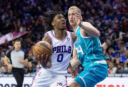 Apr 2, 2022; Philadelphia, Pennsylvania, USA; Philadelphia 76ers guard Tyrese Maxey (0) drives past Charlotte Hornets center Mason Plumlee (24) during the third quarter at Wells Fargo Center. Mandatory Credit: Bill Streicher-USA TODAY Sports