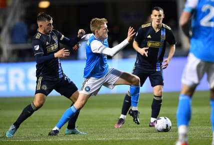 Apr 2, 2022; Philadelphia, Pennsylvania, USA; Charlotte FC forward Karol Swiderski (11) reaches for the ball against Philadelphia Union defender Kai Wagner (27) in the second half at Subaru Park. Mandatory Credit: Kyle Ross-USA TODAY Sports