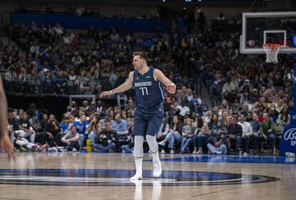 Apr 8, 2022; Dallas, Texas, USA; Dallas Mavericks guard Luka Doncic (77) runs back up the court with only one shoe on during the second half against the Portland Trail Blazers at the American Airlines Center. Mandatory Credit: Jerome Miron-USA TODAY Sports