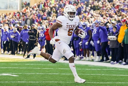 Nov 19, 2022; Lawrence, Kansas, USA; Texas Longhorns running back Bijan Robinson (5) runs for a touchdown during the first half against the Kansas Jayhawks at David Booth Kansas Memorial Stadium. Mandatory Credit: Jay Biggerstaff-USA TODAY Sports