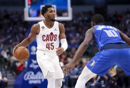 Dec 14, 2022; Dallas, Texas, USA;  Cleveland Cavaliers guard Donovan Mitchell (45) controls the ball as Dallas Mavericks forward Dorian Finney-Smith (10) defends during the second quarter at American Airlines Center. Mandatory Credit: Kevin Jairaj-USA TODAY Sports
