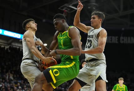 Jan 5, 2023; Boulder, Colorado, USA; Oregon Ducks center N'Faly Dante (1) and Colorado Buffaloes guard Nique Clifford (32) and forward Tristan da Silva (23) reach for a loose ball in the second half at the CU Events Center. Mandatory Credit: Ron Chenoy-USA TODAY Sports