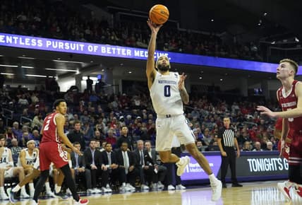 Jan 23, 2023; Evanston, Illinois, USA; Northwestern Wildcats guard Boo Buie (0) scores aWisconsin Badgers during the second half at Welsh-Ryan Arena. Mandatory Credit: David Banks-USA TODAY Sports