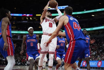 Dec 30, 2022; Chicago, Illinois, USA; Detroit Pistons forward Bojan Bogdanovic (44) defends Chicago Bulls guard Zach LaVine (8) during the second half at United Center. Mandatory Credit: David Banks-USA TODAY Sports