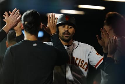Jun 6, 2023; Denver, Colorado, USA; San Francisco Giants first baseman LaMonte Wade Jr. (31) celebrates scoring a run in the seventh inning against the Colorado Rockies at Coors Field. Mandatory Credit: Ron Chenoy-USA TODAY Sports