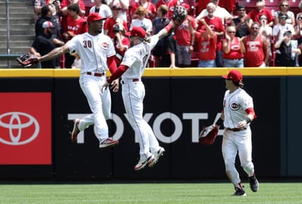 Jun 21, 2023; Cincinnati, Ohio, USA; Cincinnati Reds left fielder Will Benson (30) right fielder Jake Fraley (27) and center fielder TJ Friedl (29) celebrate after the Reds defeated the Colorado Rockies at Great American Ball Park. Mandatory Credit: David Kohl-USA TODAY Sports