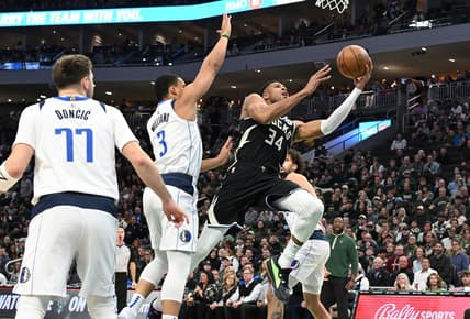 Nov 18, 2023; Milwaukee, Wisconsin, USA; Milwaukee Bucks forward Giannis Antetokounmpo (34) drives to the basket against Dallas Mavericks forward Grant Williams (3) in the first half at Fiserv Forum. Mandatory Credit: Michael McLoone-USA TODAY Sports