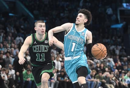 Nov 20, 2023; Charlotte, North Carolina, USA; Charlotte Hornets guard LaMelo Ball (1) drives past Boston Celtics guard Payton Pritchard (11) during the second half at the Spectrum Center. Mandatory Credit: Sam Sharpe-USA TODAY Sports