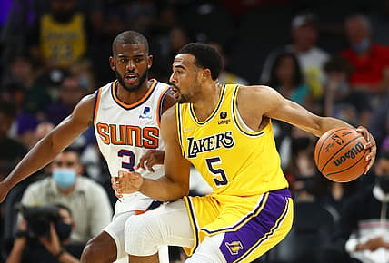 Oct 6, 2021; Phoenix, Arizona, USA; Los Angeles Lakers guard Talen Horton-Tucker (5) against Phoenix Suns guard Chris Paul (3) during a preseason game at Footprint Center. Mandatory Credit: Mark J. Rebilas-USA TODAY Sports