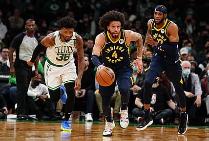 Jan 10, 2022; Boston, Massachusetts, USA; Indiana Pacers guard Duane Washington Jr. (4) returns the ball against Boston Celtics guard Marcus Smart (36) in the first quarter at TD Garden. Mandatory Credit: David Butler II-USA TODAY Sports