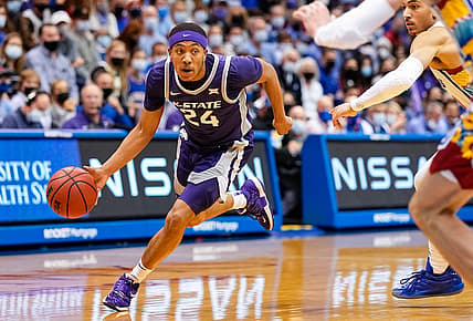 Feb 22, 2022; Lawrence, Kansas, USA; Kansas State Wildcats guard Nijel Pack (24) drives past Kansas Jayhawks forward Jalen Wilson (10) during the first half at Allen Fieldhouse. Mandatory Credit: Jay Biggerstaff-USA TODAY Sports