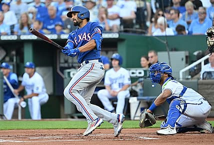 Jun 28, 2022; Kansas City, Missouri, USA;  Texas Rangers second baseman Marcus Semien (2) singles during the first inning against the Kansas City Royals at Kauffman Stadium. Mandatory Credit: Peter Aiken-USA TODAY Sports