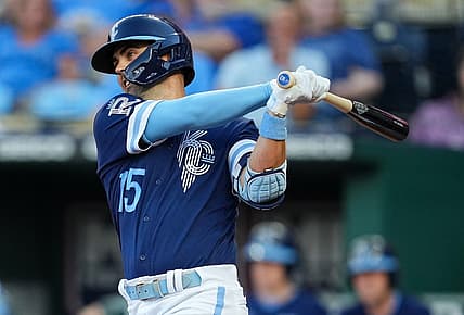 Jul 8, 2022; Kansas City, Missouri, USA; Kansas City Royals second baseman Whit Merrifield (15) hits a single against the Cleveland Guardians during the third inning at Kauffman Stadium. Mandatory Credit: Jay Biggerstaff-USA TODAY Sports