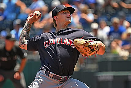 Jul 10, 2022; Kansas City, Missouri, USA;  Cleveland Guardians starting pitcher Zach Plesac (34) delivers a pitch during the first inning against the Kansas City Royals at Kauffman Stadium. Mandatory Credit: Peter Aiken-USA TODAY Sports
