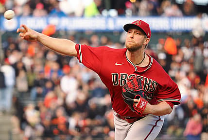 Jul 11, 2022; San Francisco, California, USA; Arizona Diamondbacks starting pitcher Merrill Kelly (29) pitches the ball against the San Francisco Giants during the first inning at Oracle Park. Mandatory Credit: Kelley L Cox-USA TODAY Sports