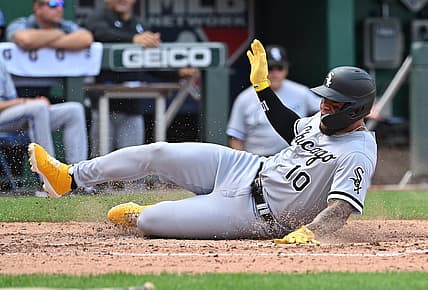 Aug 22, 2022; Kansas City, Missouri, USA;  Chicago White Sox third baseman Yoan Moncada (10) slides into home plate to score a run during the fourth inning against the Kansas City Royals at Kauffman Stadium. Mandatory Credit: Peter Aiken-USA TODAY Sports