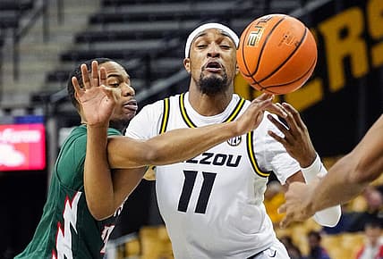 Nov 20, 2022; Columbia, Missouri, USA; Mississippi Valley State Delta Devils guard Kadar Waller (3) knocks the ball away from Missouri Tigers guard Isiaih Mosley (11) during the second half at Mizzou Arena. Mandatory Credit: Jay Biggerstaff-USA TODAY Sports
