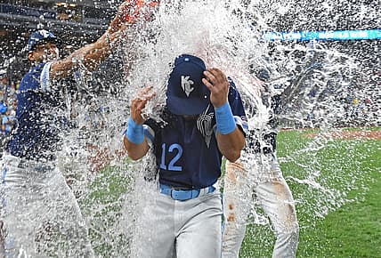 Sep 1, 2023; Kansas City, Missouri, USA;  Kansas City Royals designated hitter Nick Loftin (12) gets doused with water following a win over the Boston Red Sox at Kauffman Stadium. Mandatory Credit: Peter Aiken-USA TODAY Sports