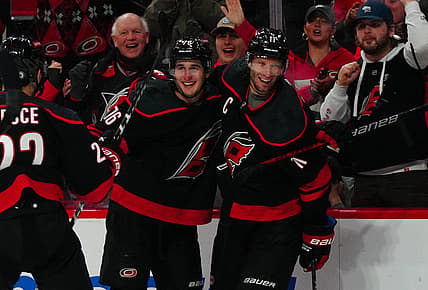 Dec 19, 2023; Raleigh, North Carolina, USA; Carolina Hurricanes defenseman Brady Skjei (76) celebrates his goal with center Jordan Staal (11) against the Vegas Golden Knights during the third period at PNC Arena. Mandatory Credit: James Guillory-USA TODAY Sports