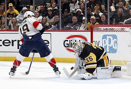Feb 14, 2024; Pittsburgh, Pennsylvania, USA; Pittsburgh Penguins goaltender Tristan Jarry (35) makes a save against Florida Panthers left wing Matthew Tkachuk (19) during the second period at PPG Paints Arena. Mandatory Credit: Charles LeClaire-USA TODAY Sports