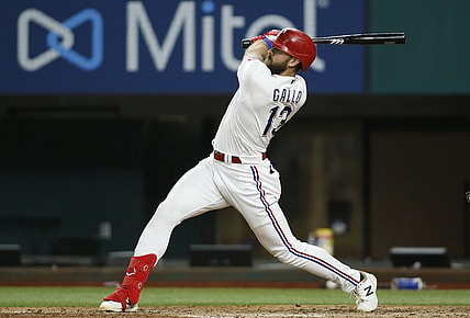 Jul 27, 2021; Arlington, Texas, USA; Texas Rangers right fielder Joey Gallo (13) hits a three run home run in the fourth inning against the Arizona Diamondbacks at Globe Life Field. Mandatory Credit: Tim Heitman-USA TODAY Sports